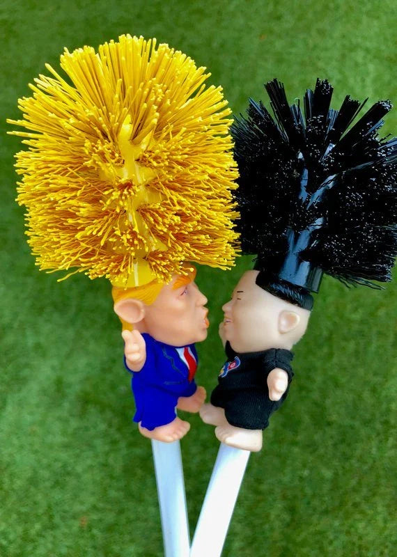 Bright yellow Trump-themed toilet brush with hanging slot