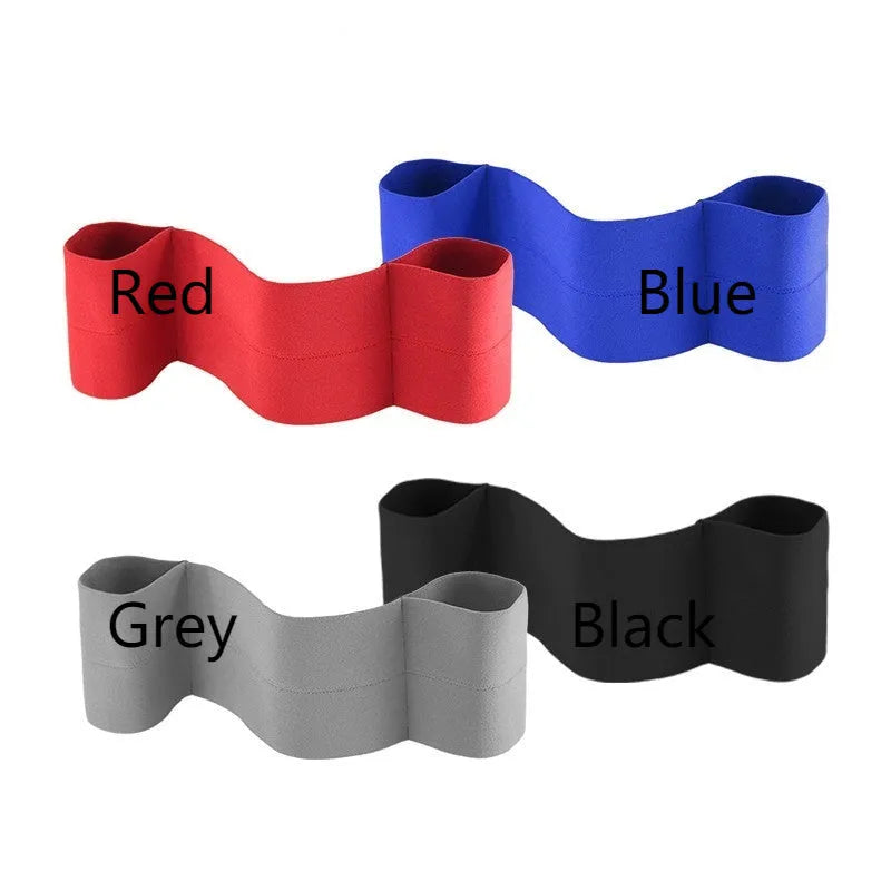 Black elastic elbow support bandage wrapped around an adult arm during a fitness training session.