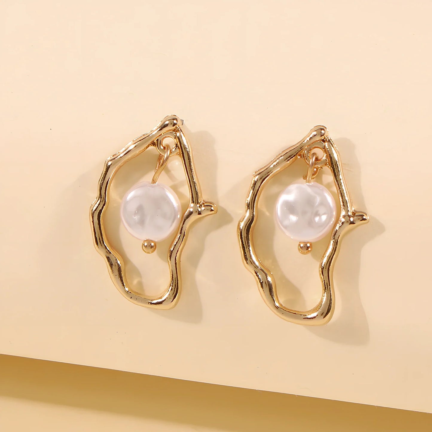 Gold alloy irregular pearl earrings with European-American styling for women