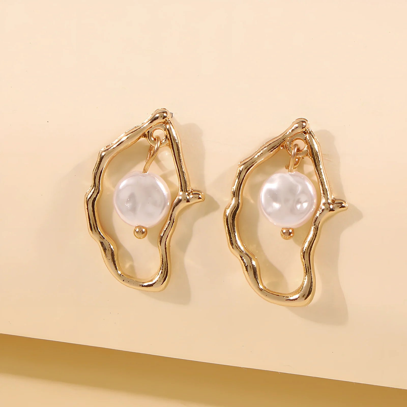 Gold alloy irregular pearl earrings with European-American styling for women