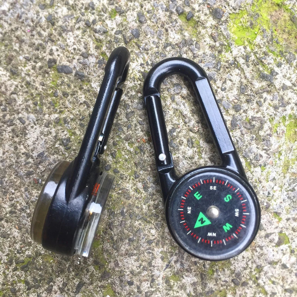 Black zinc alloy double-sided button carabiner with visible thermometer and compass gauge.
