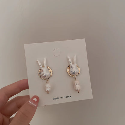 Silver bunny character earrings with baroque pearls measuring 2.5cm length with electroplated finish
