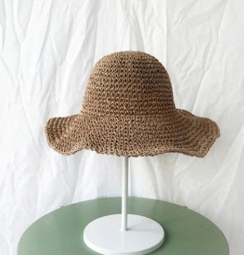 Women's foldable straw sun hat with wide brim for summer sun protection