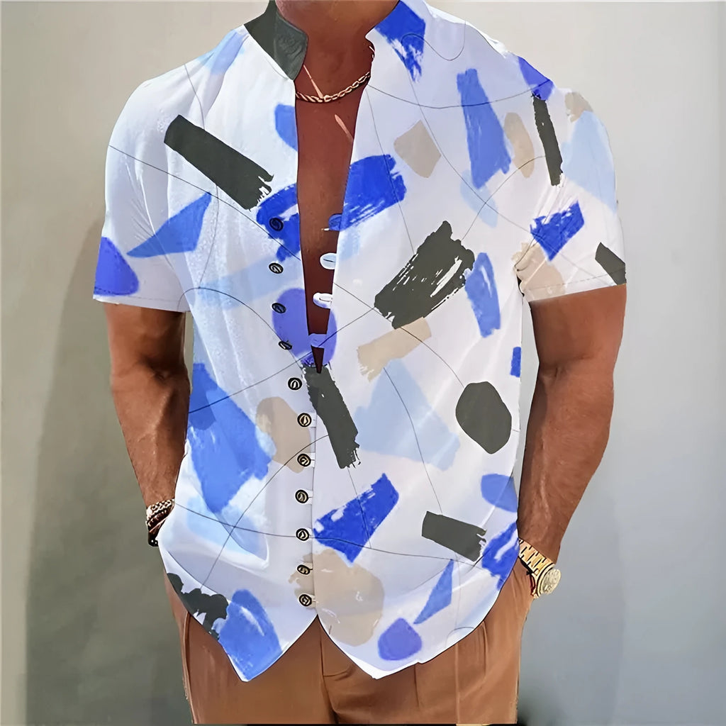 Youth wearing a short-sleeve cardigan shirt with a geometric 3D printed floral pattern in a blue colour.