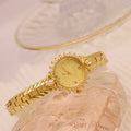 Women's vintage quartz bracelet watch with gold surface showing 6mm thickness and diamond embossed detail