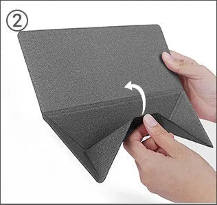 Blue foldable aluminium laptop cooling bracket open on a desk next to a laptop.