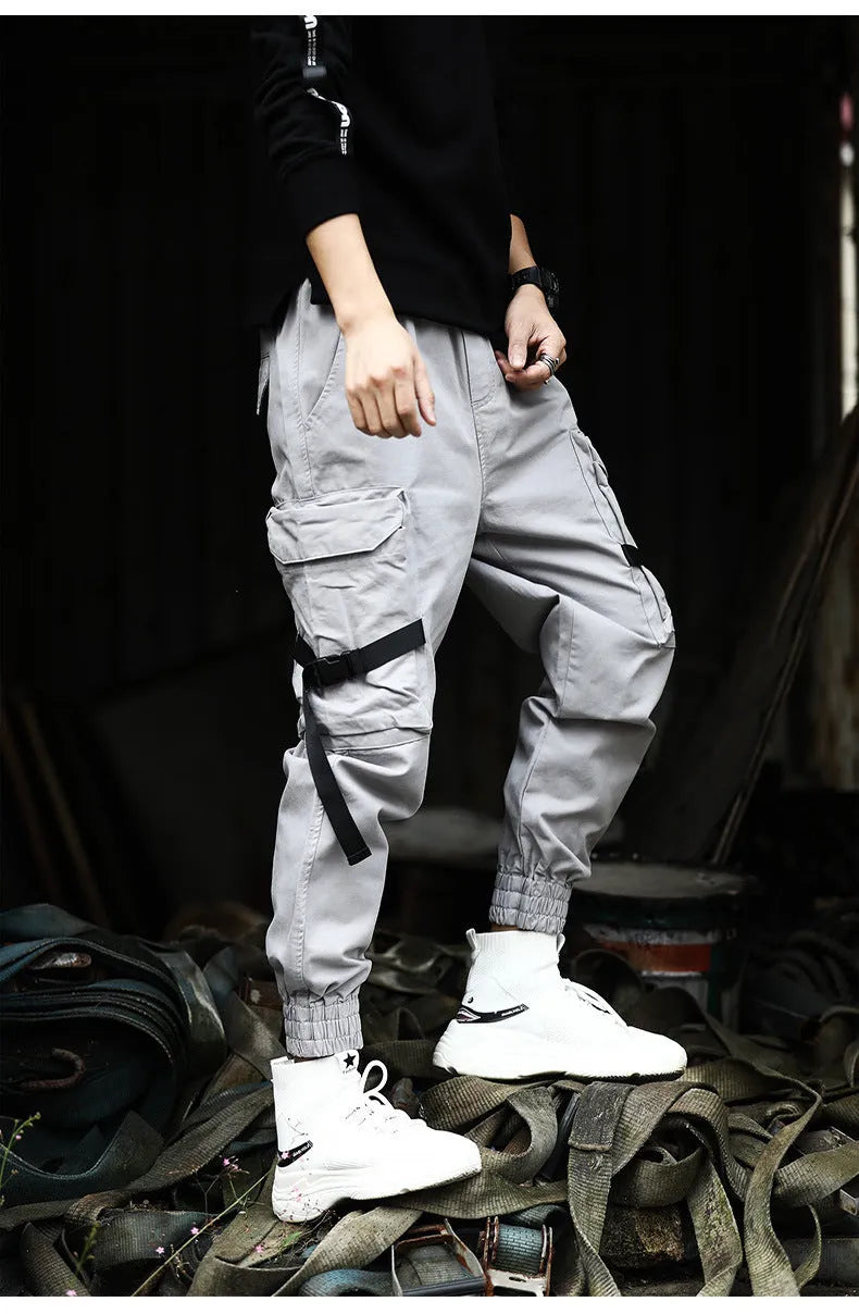 Men's casual cotton cargo pants in black with multiple pockets, available in Asian sizes S to XL