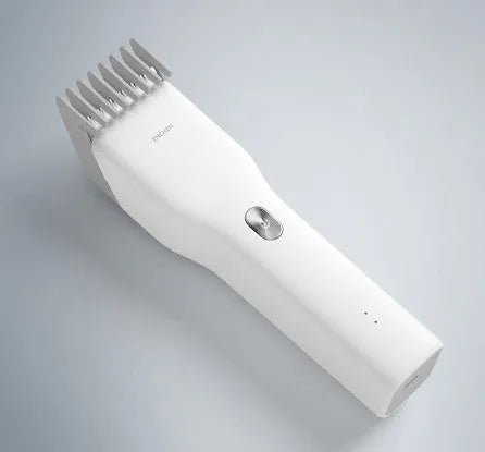 Black cordless electric hair clipper with adjustable comb and ceramic cutter head on a white background