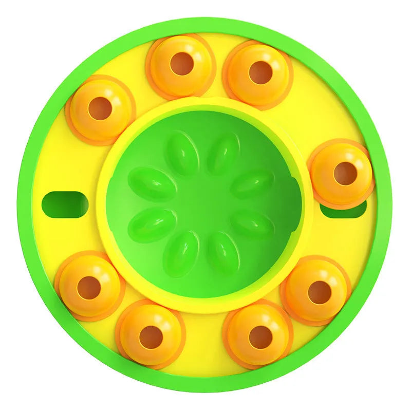 Square green dog puzzle feeder bowl with rotating turntable top and non-slip rubber base.