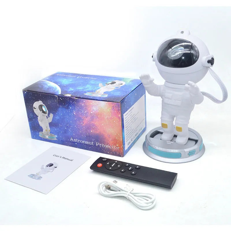 Exit Astronaut Starlight Projection Lamp in white with USB cable and remote control on a table