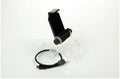 Black PS4 controller clip holding a mobile phone, with OTG cable connected.