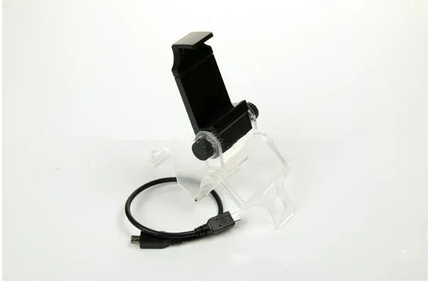 Black PS4 controller clip holding a mobile phone, with OTG cable connected.