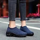 Women's air cushion walking shoes with breathable mesh upper, available in black, purple, grey, dark blue