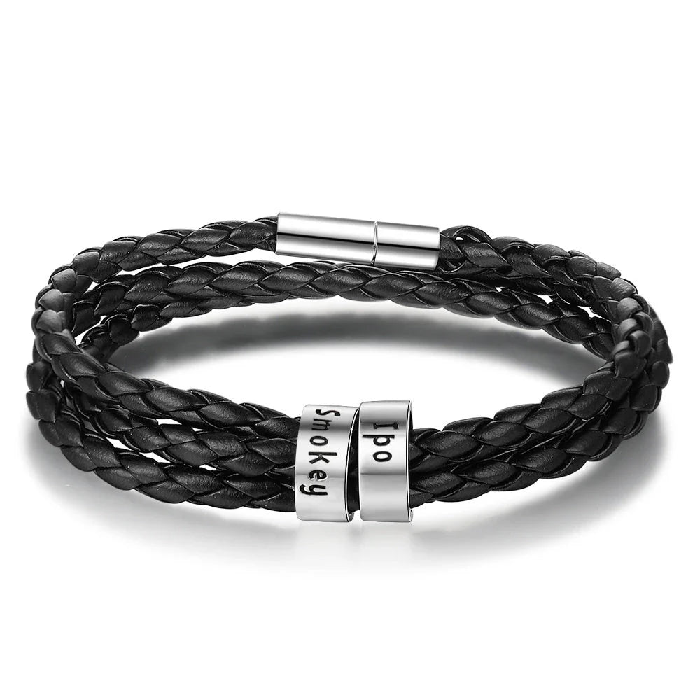 Personalized braided leather bracelet with engraved charm for men, available in black, brown, and navy colors