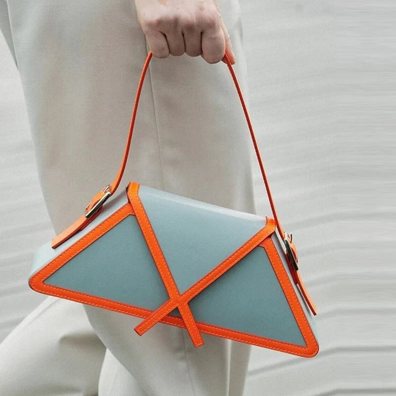 Stitching contrast trapezoid shoulder bag in black, beige, blue, and orange
