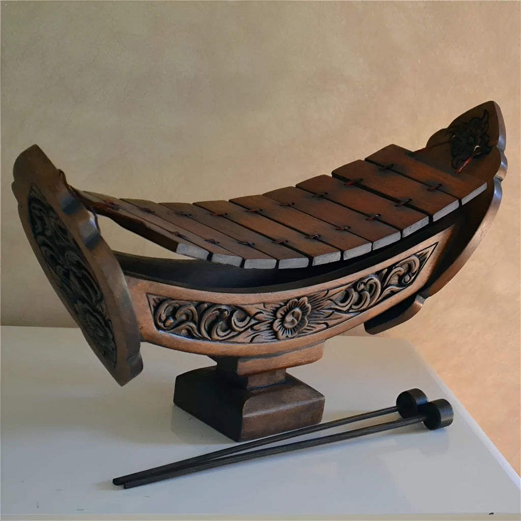 Brown wooden hand xylophone decorative pendant measuring 27x16cm in Southeast Asian style