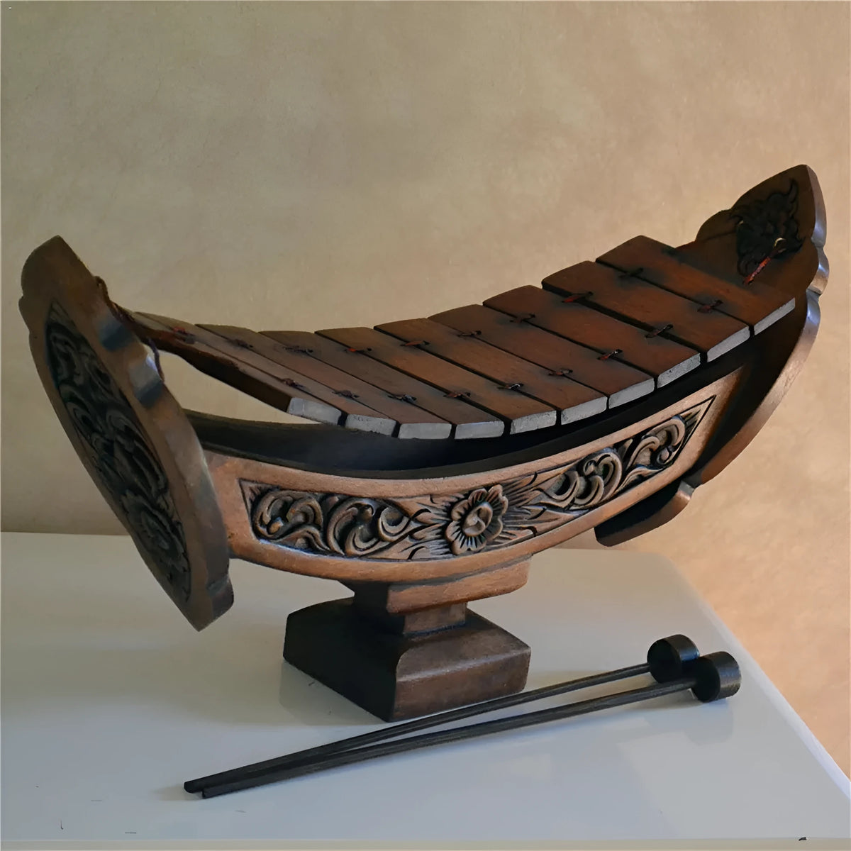 Brown wooden hand xylophone decorative pendant measuring 27x16cm in Southeast Asian style