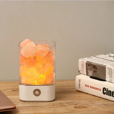 Himalayan salt lamp with natural pink-orange glow, releasing negative ions to purify the air and create a calming, relaxing atmosphere