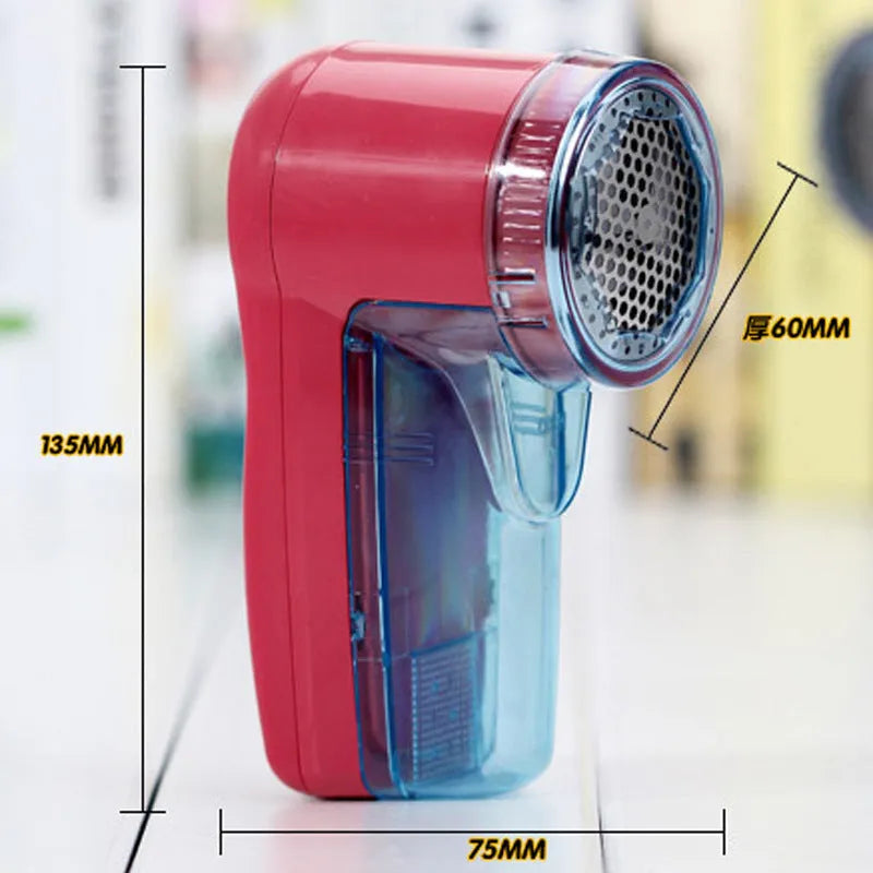 Portable electric clothing lint remover and fabric shaver on a white background.