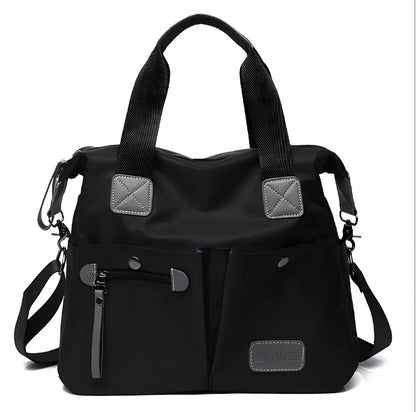 Ladies shoulder bag in black Oxford fabric, size M with multiple pockets and adjustable straps for handbag or crossbody carry, 340 mm width