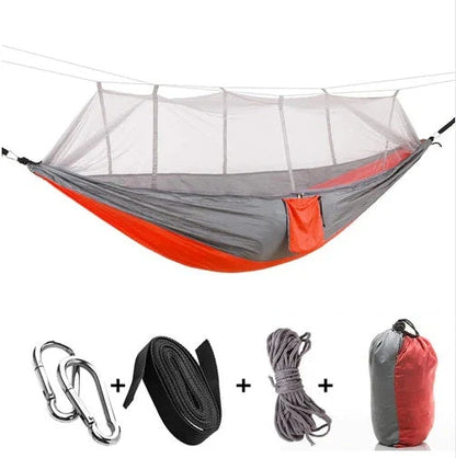 Parachute hammock with mosquito net in various colors and sizes, ideal for outdoor adventures and relaxation