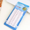 Self-adhesive cable organiser clips in various colours mounted on wall with wires organised