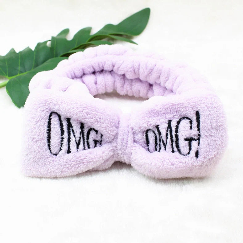 Coral velvet butterfly end hair band in pink with text styling, showing butterfly ends and cloth material