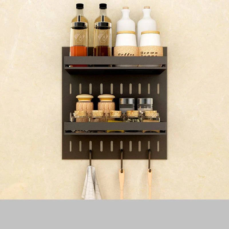 Wall-mounted stainless steel kitchen organiser with multiple storage compartments and hooks