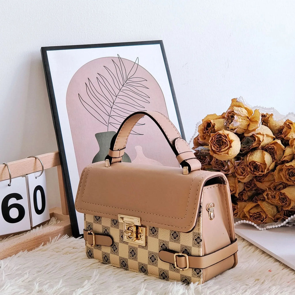 Small square retro patterned crossbody bag in PU leather with a file compartment inside.