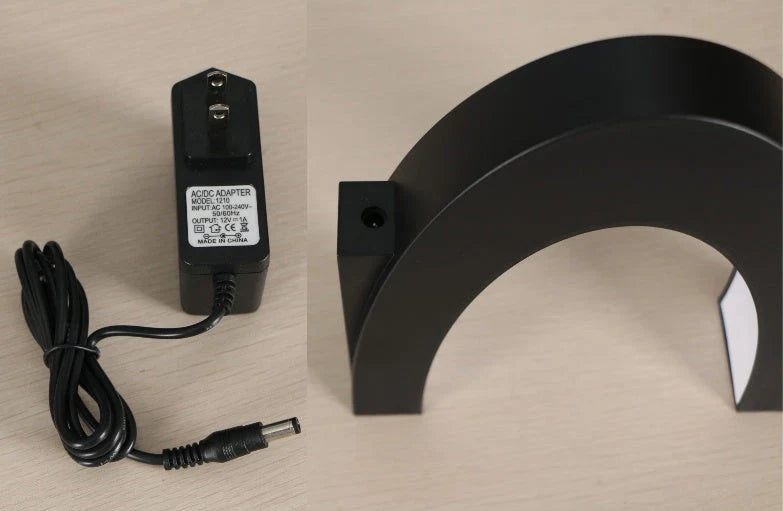 Magnetic levitation globe floating above base with LED light on