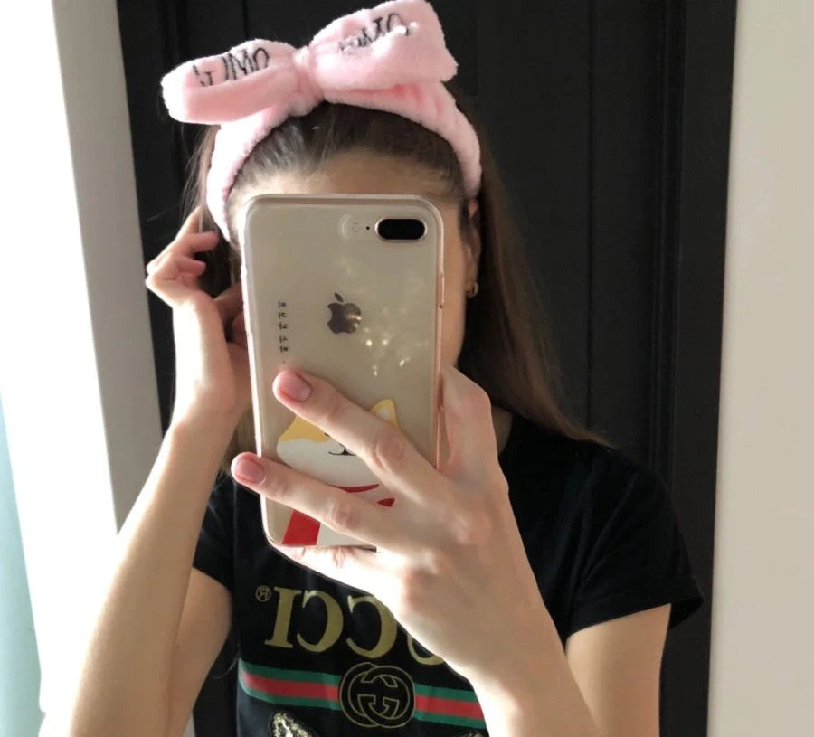 Coral velvet butterfly end hair band in pink with text styling, showing butterfly ends and cloth material