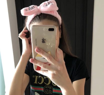 Coral velvet butterfly end hair band in pink with text styling, showing butterfly ends and cloth material