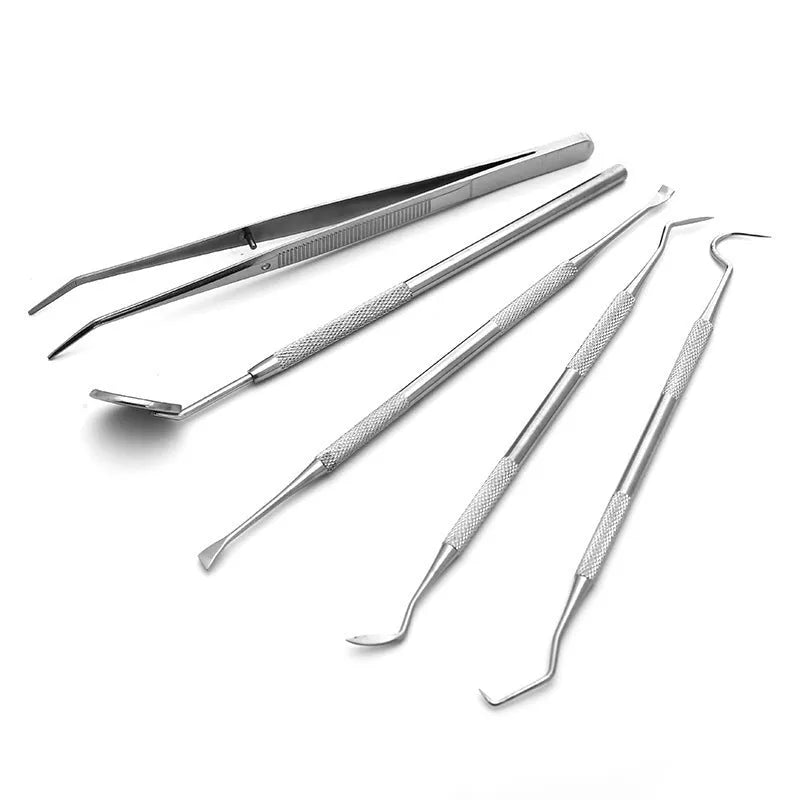 Stainless steel dental tools set with oral mirror and probes on grey background