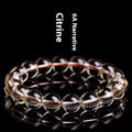 Natural citrine scattered beads ball bracelet in 7A grade colour on a wrist.