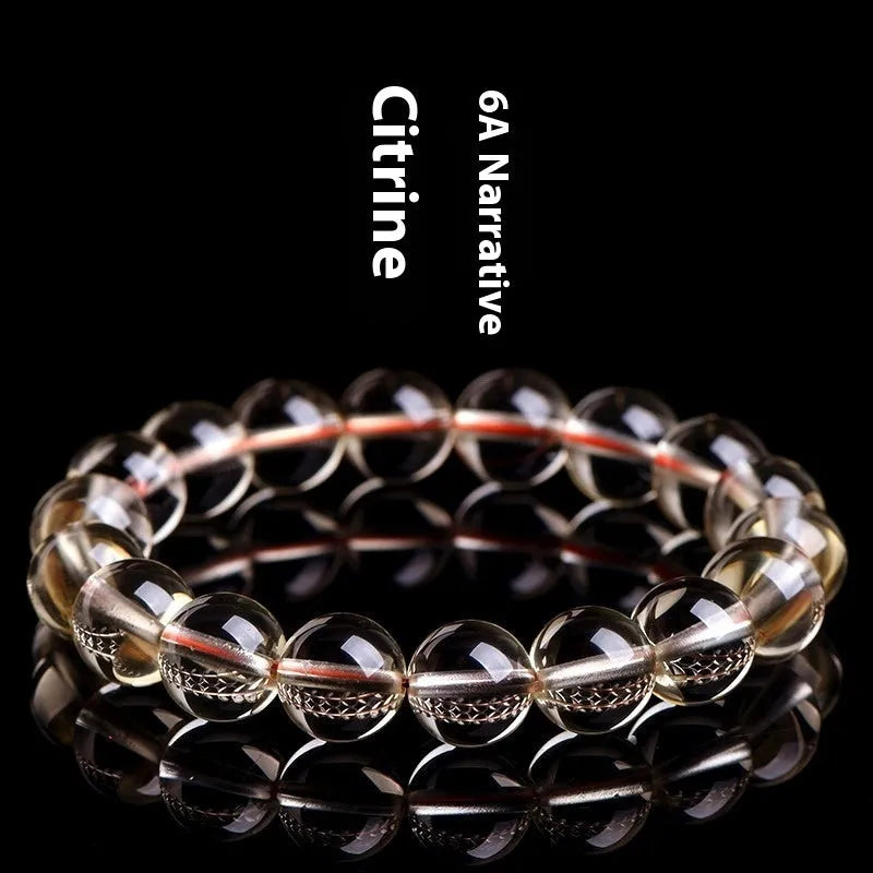 Natural citrine scattered beads ball bracelet in 7A grade colour on a wrist.
