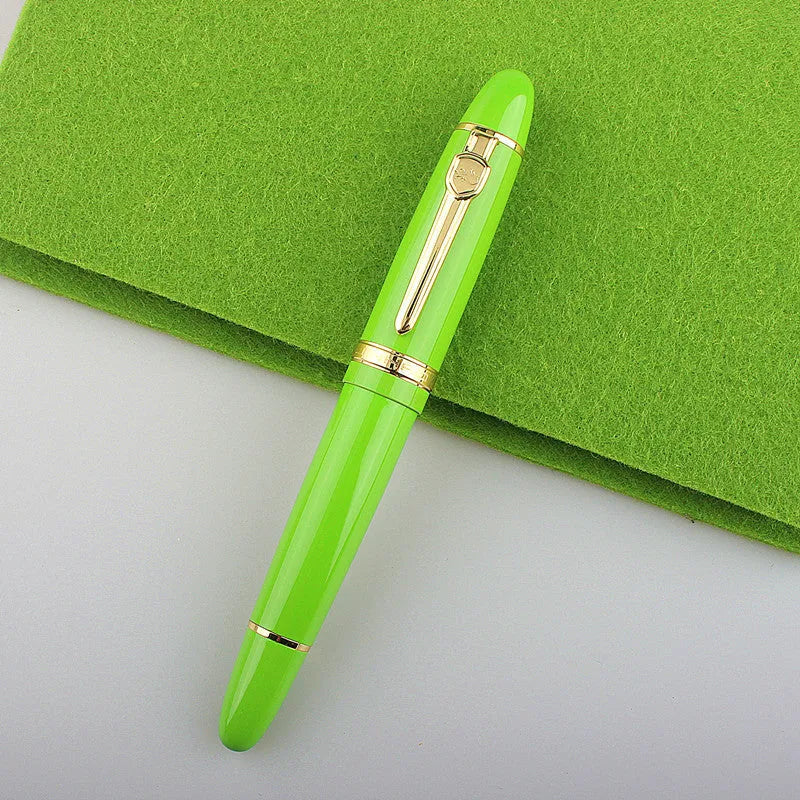 Metal ball pen with pearl beads and gold clip on white background