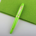 Metal ball pen with pearl beads and gold clip on white background