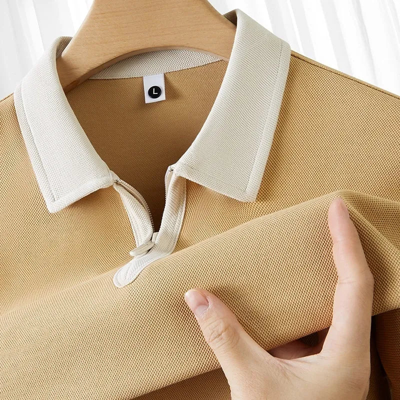 Loose fit navy blue zip and lapel polo shirt on a hanger