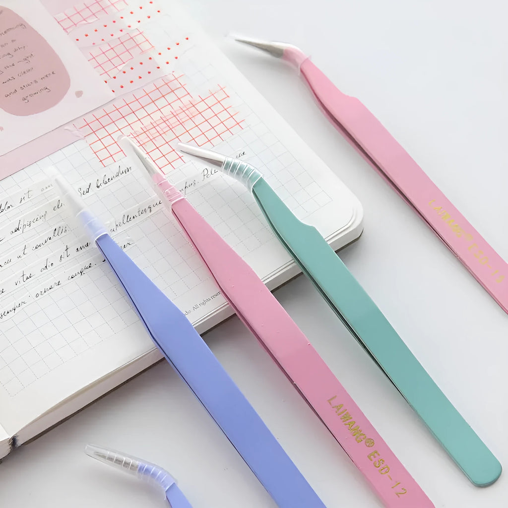 Stainless steel macaron-coloured tweezers in blue, green, and pink with straight and elbow tip styles on paper card packaging