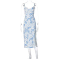 Women's floral lace print long dress with suspender straps and a thigh slit, shown in blue.
