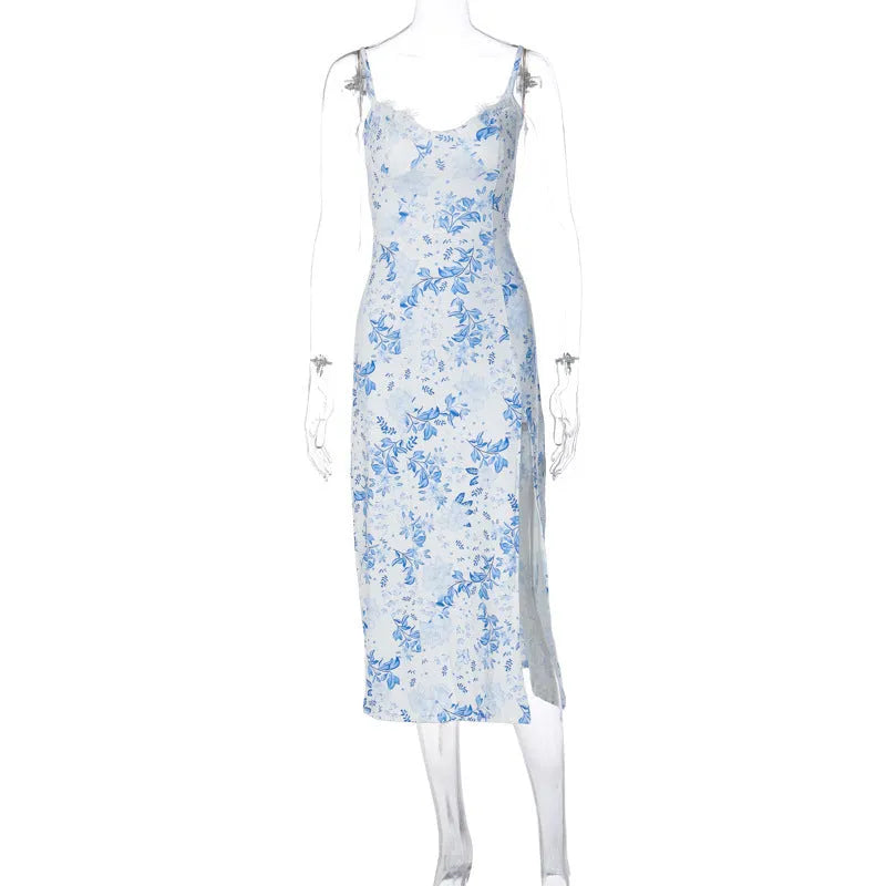 Women's floral lace print long dress with suspender straps and a thigh slit, shown in blue.