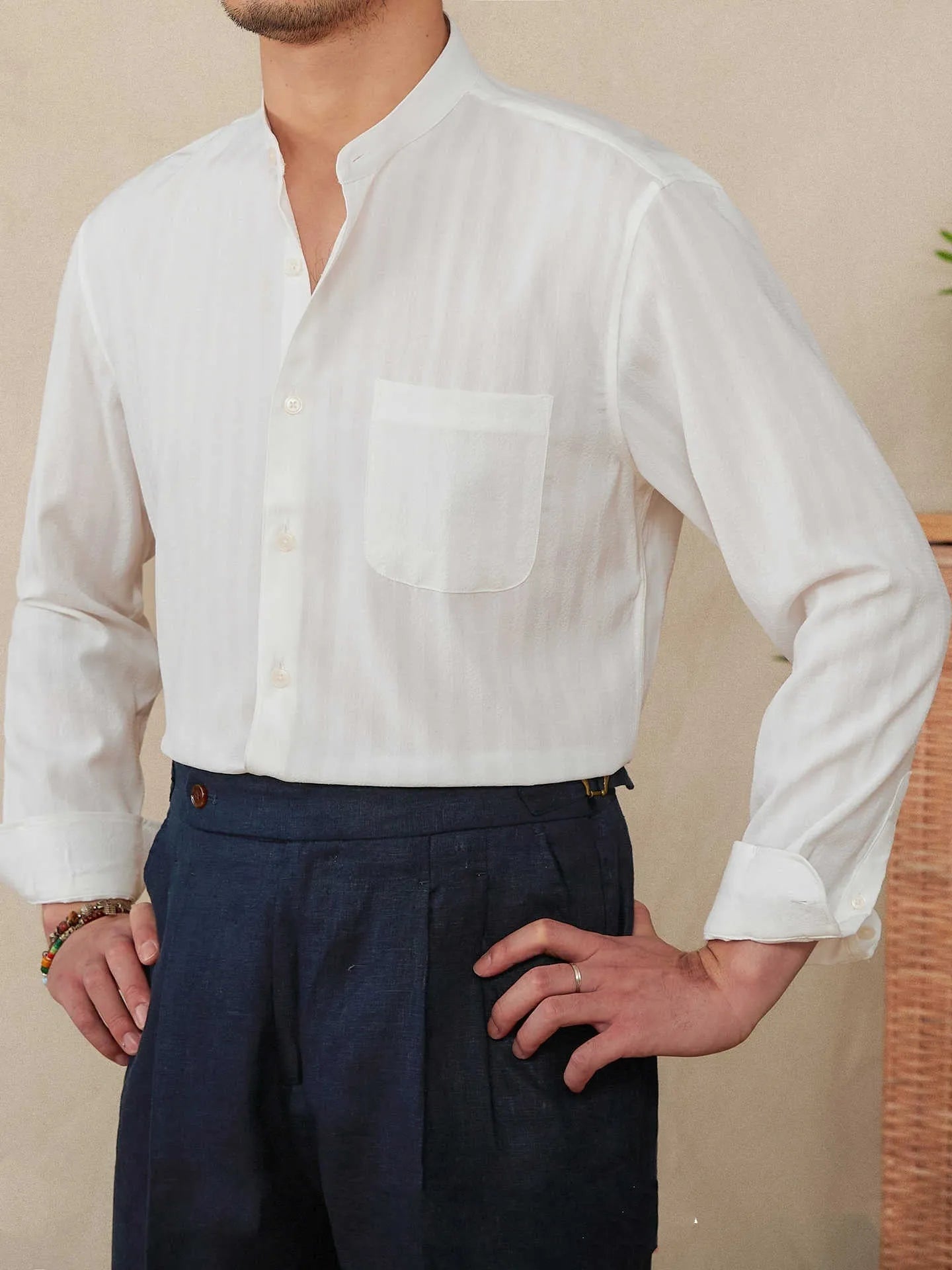 Blue and white seersucker striped long sleeve shirt with a loose lapel and baseball collar.