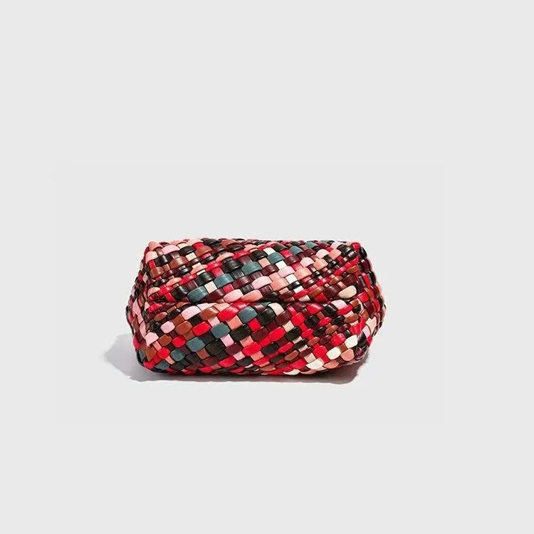 Women's woven PU leather shoulder bag showing handmade detailing and 18x11x14cm dimensions