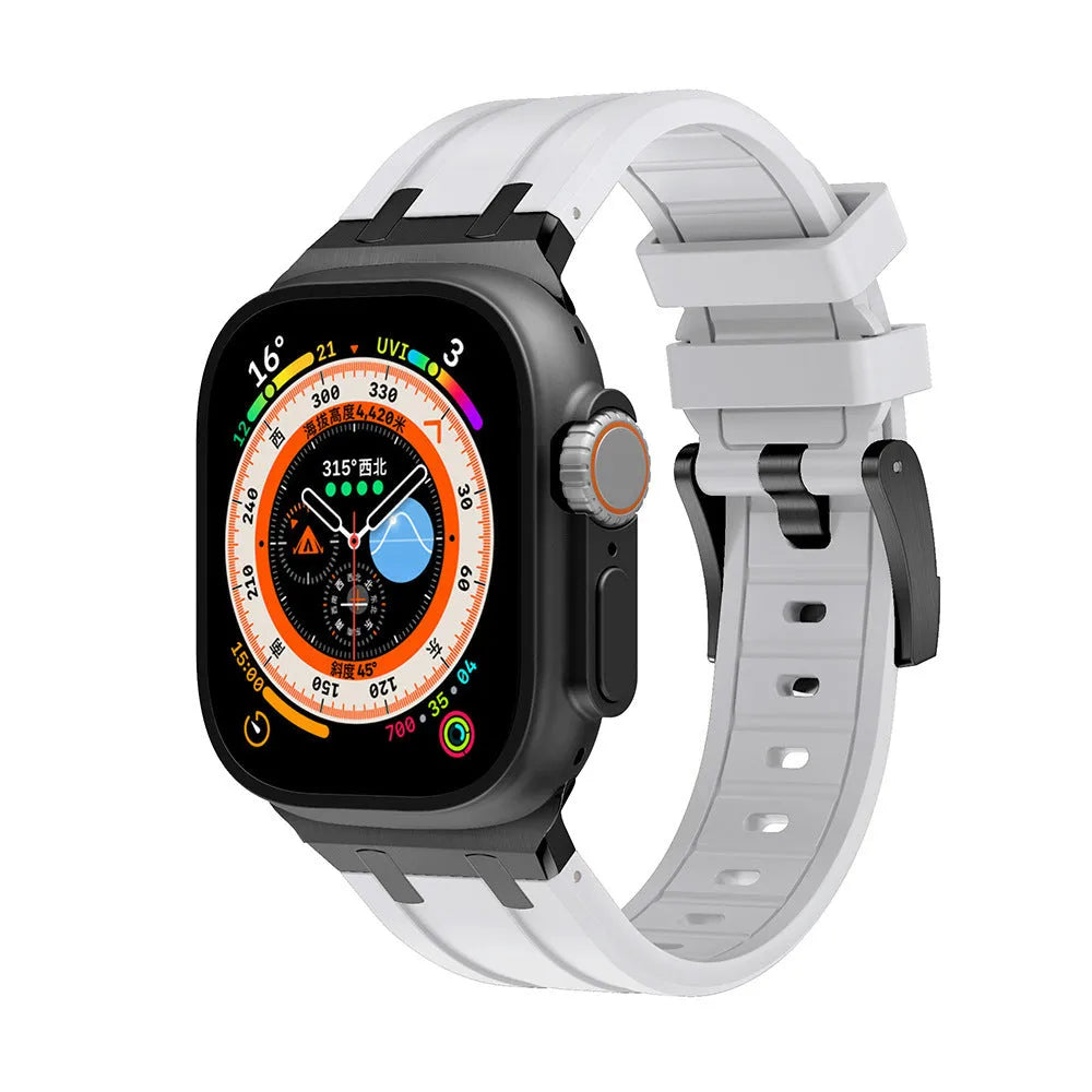 Liquid silicone Richard modified wrist strap for Apple Watch, silver blue butterfly clasp variant, on a table