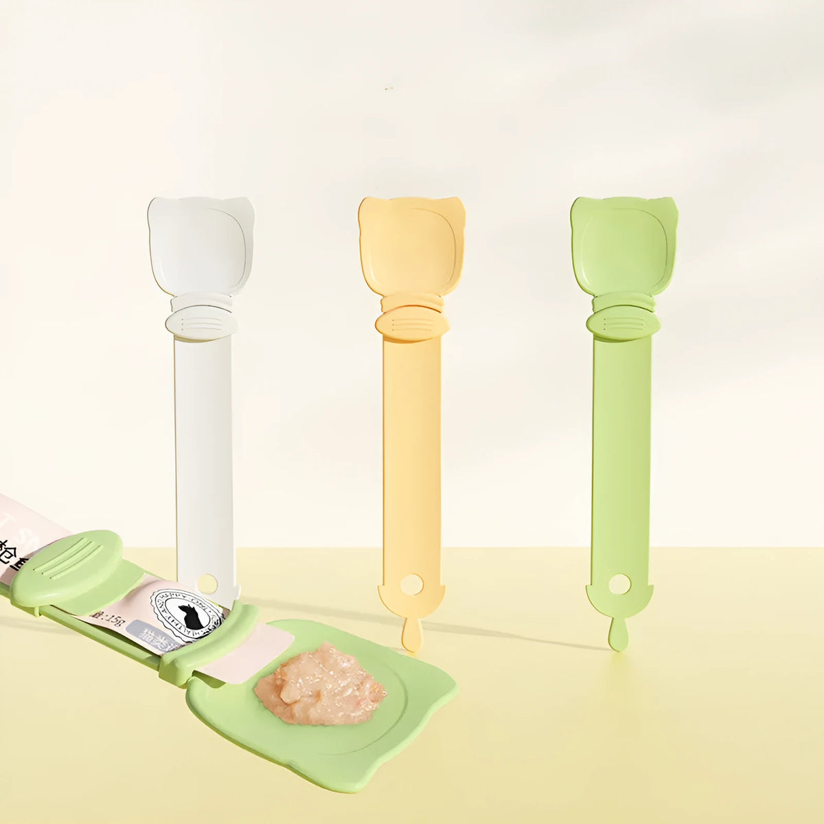 Cat strip squeezing machine in beige, 27x6.5cm HIPS plastic extruder on a countertop