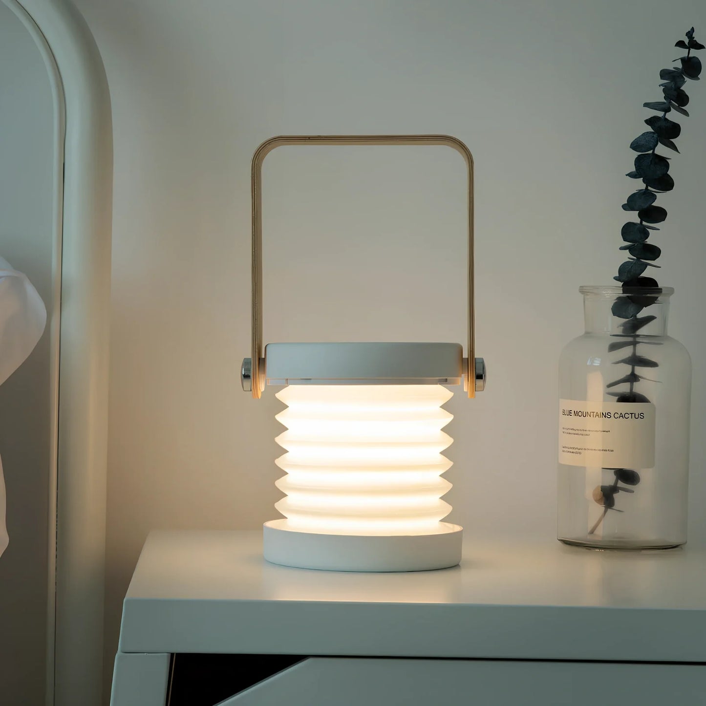 USB rechargeable lantern night light with touch dimming and 360-degree rotation in white finish