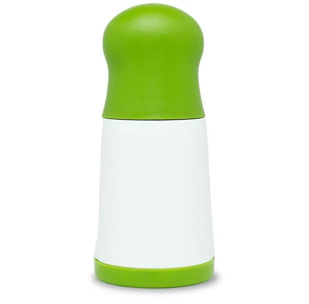 White and silver handheld herb grinder with removable top on a kitchen counter.