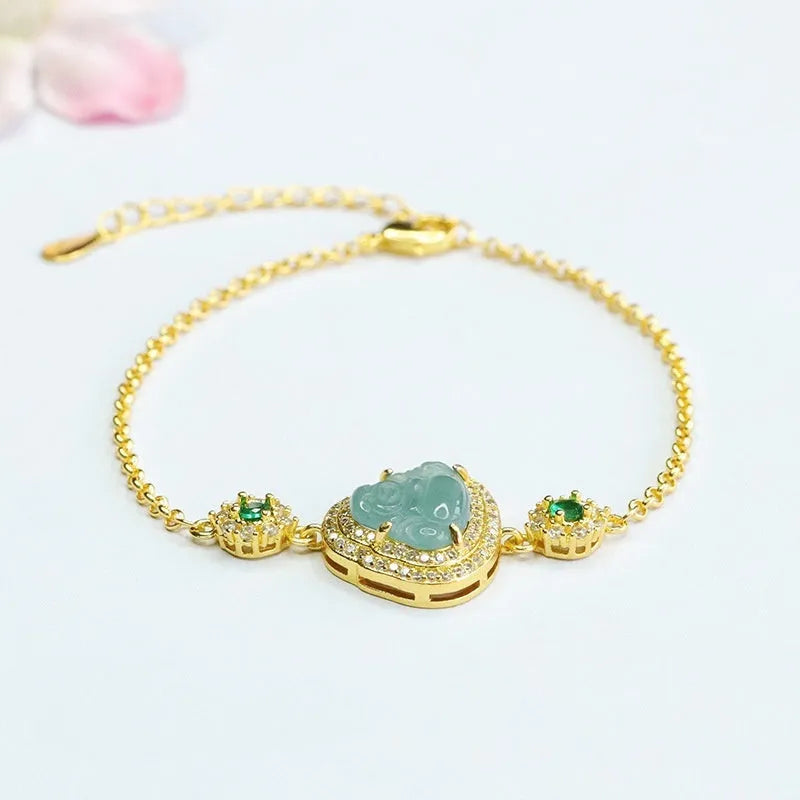 Blue water jade bracelet with oval 10x13mm bead showing inlaid Maitreya Buddha carving