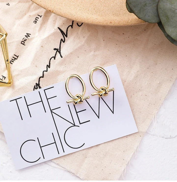 Gold cold oval knotted stud earrings made from durable alloy
