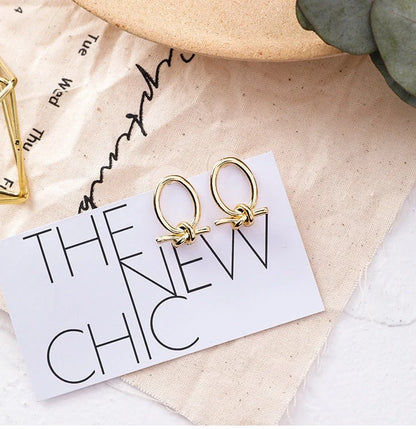 Gold cold oval knotted stud earrings made from durable alloy